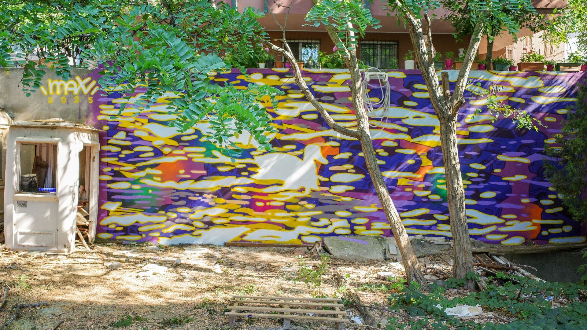 This mural is designed to reflect sunlight on water, shimmering sea surfaces, and the flow of traffic, movements that seem different yet share the same rhythm.
As for the duo floating in the water, they’re the inseparable pair that appears on Kalamış shore in the late afternoon. We don’t complain that they swim in the sea. On the contrary, we embrace them and consider them part of our lives.
May the mindset that believes everything and everyone can be controlled be cursed, always and everywhere.